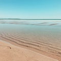 A deserted sandy beach on a summer afternoon. Paradise summer vacation.