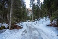 Deserted snowy forest road in a the mountains Royalty Free Stock Photo