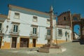 Deserted square with marble pillory and old buildings Royalty Free Stock Photo