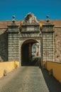 Deserted street going toward the city wall gateway and traffic sign Royalty Free Stock Photo