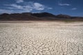 The deserted tokirs on ground are cracked from drought, the bottom of the lake is exposed, the water has evaporated from the heat Royalty Free Stock Photo