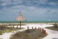 Deserted tropical beach with natural umbrella Royalty Free Stock Photo