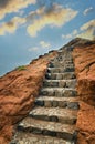 Volcanic rock with stone stairs towards the sky Royalty Free Stock Photo