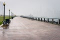 Deserted Waterfront Footpath under Heavy Rain
