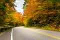 Deserted Winding Road on a Cloudy Autumn Day Royalty Free Stock Photo