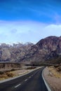 Highway crossin valley going to mountains Royalty Free Stock Photo