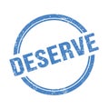 DESERVE text written on blue grungy round stamp