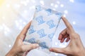 Desiccant Silica gel bag on hand Royalty Free Stock Photo