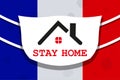 Design with abstract silhouette of the coronavirus of the flag of France and the roof of the house. Sign of COVID-2019.