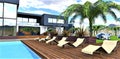 The design of the arrangement of sun loungers on a wooden deck near the pool in front of an elite country house. 3d rendering Royalty Free Stock Photo