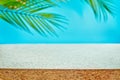 Design banner ads on summer season display concept , abstract blur tropical coconut leaves with white concrete table background Royalty Free Stock Photo