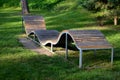 Design bench in the shape of a wavy line. wooden paneling on a metal galvanized frame. The bench is atypical to order in a city pa