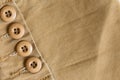 Design botton of brown shirt on fabric textile Royalty Free Stock Photo