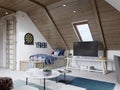 The design of the children`s room for the teenager on the attic is in the loft style, the ceiling is hemmed with wood and the Royalty Free Stock Photo