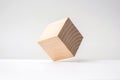 Abstract geometric real wooden cube with surreal layout on white background