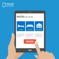 Design concept of hotel booking online. Tablet computer with hand touching a screen. Display with book button and bed