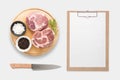 Design concept of mockup clip board and pork on cutting board se Royalty Free Stock Photo