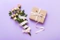 design concept with pink rose flower and gift box on colored table background top view. Happy Holiday, Mothers day Royalty Free Stock Photo