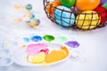 Design concept - Preparing for Easter celebration, painting Easter eggs with colorful Acrylic pigment color dyestuff in palette,