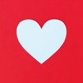 Design Of Cutting White Paper Heart On Red Paper Background