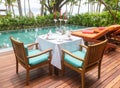 Design dinner set poolside in pool villa. Royalty Free Stock Photo