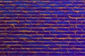 Design element. Ancient brick wall texture toned in ultra violet colour.