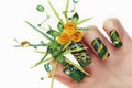 Design green acrylic nails with yellow roses .