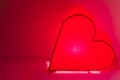 Design, home decor for happy valentine`s day for lovers. romantic red lamp, lantern in the form of a luminous heart Royalty Free Stock Photo