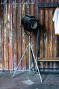 Design of loft Interior of dressing room. Metal wall and cinema lightning and white t-shirt on background. Copyspace for