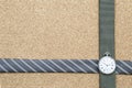 Design men necktie and vintage watch on brown texture background Royalty Free Stock Photo