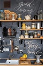 Design of modern stylish home kitchen in rustic loft style and. Black chalk wall with shelves, trays, jars, mugs, sink, Royalty Free Stock Photo