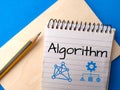 Design of notebook, pencil, and icon with text algorithm on blue background. Royalty Free Stock Photo