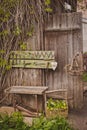 design of the photo zone in a rustic style, old wooden doors and boards with tools and spring flowers