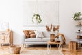 Sunny living room with boho accessories. Royalty Free Stock Photo