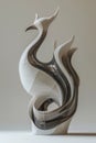 Design a sleek phoenix sculpture in clay with a side view using an abstract twist Royalty Free Stock Photo