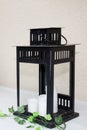 Design vintage modern black metal lantern with white candle light