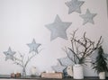 The design of the wall, the interior. Star. Dry branches Candles Royalty Free Stock Photo