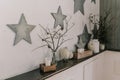 The design of the wall, the interior. Star. Dry branches Candles Royalty Free Stock Photo