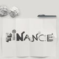design word FINANCE on white crumpled paper and texture background as concept