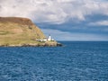 Designed by brothers David and Thomas Stevenson, Bressay Lighthouse on a sunny day, against a blue sky with white clouds