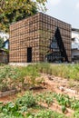 Designed farm house made by straw and black steel with triangle window form at the restaurant in Chiang Mai, Thailand