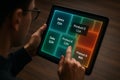 Designer Analyzing Interactive Glowing Treemap on Tablet with Data Hierarchy and Performance Metrics Royalty Free Stock Photo