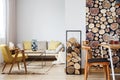 Sofa, firewood and dining area Royalty Free Stock Photo