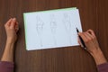 Designer assessing fashion drawings