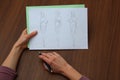 Designer assessing fashion drawings