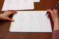 Designer assessing fashion drawings