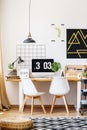 Designer chairs and wooden desk