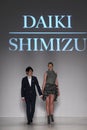 Designer Daiki Shimizu and model walk the runway during the Charity Water fashion show