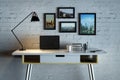 Designer desk with empty laptop