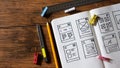 Designer desk with wireframe sketches for responsive website. Royalty Free Stock Photo